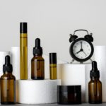 Cosmetic products and clock, morning and evening skin and body care concept
