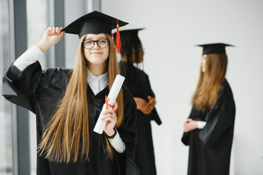 Educational theme: graduating student girl in an academic gown.