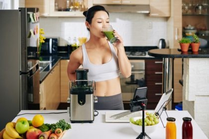 Female athlete drinking green smoothie