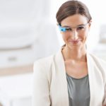 Instant access. Portrait of a young businesswoman wearing smart glasses at work.